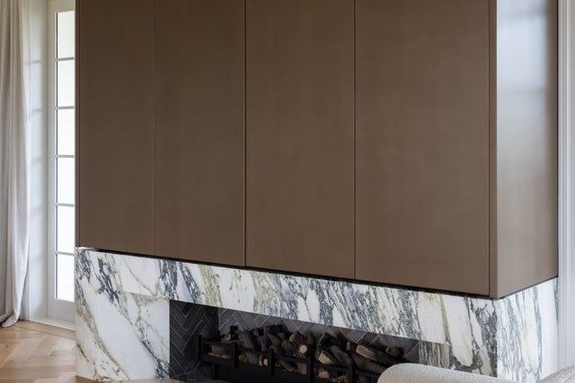 StudioMetalier bronze panels over marble fireplace surround, private residence